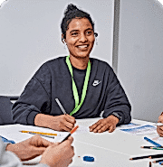 Student writing notes in class