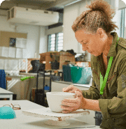 Student working on a ceramics project