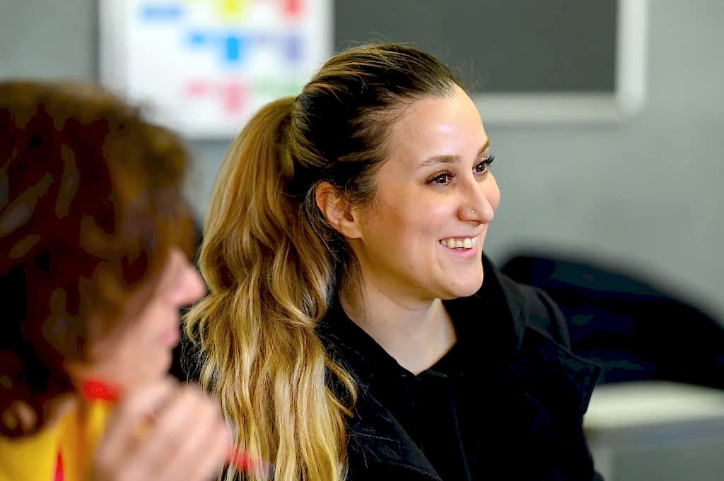 Young women smiling in class
