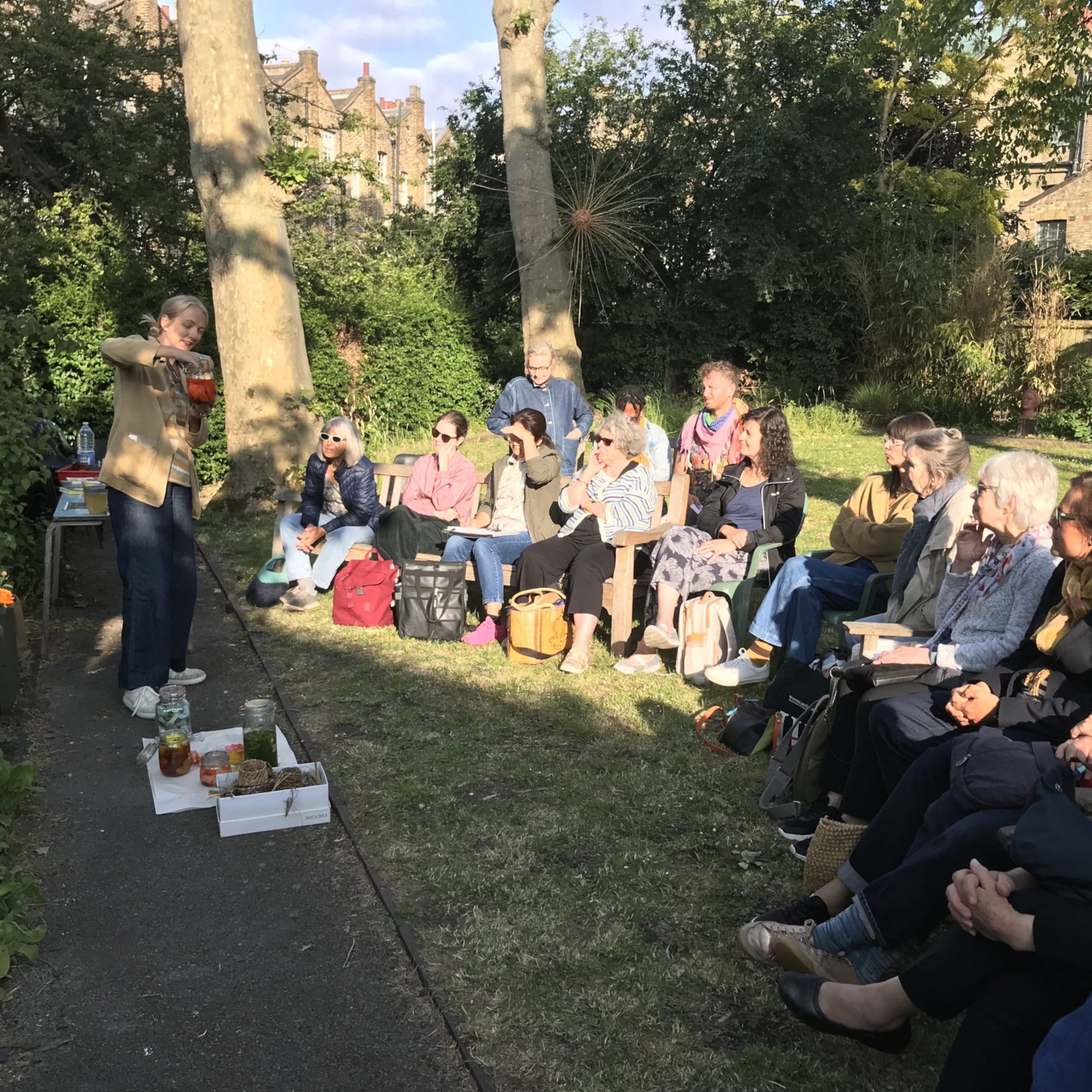 People sitting in Morley College's dye garden